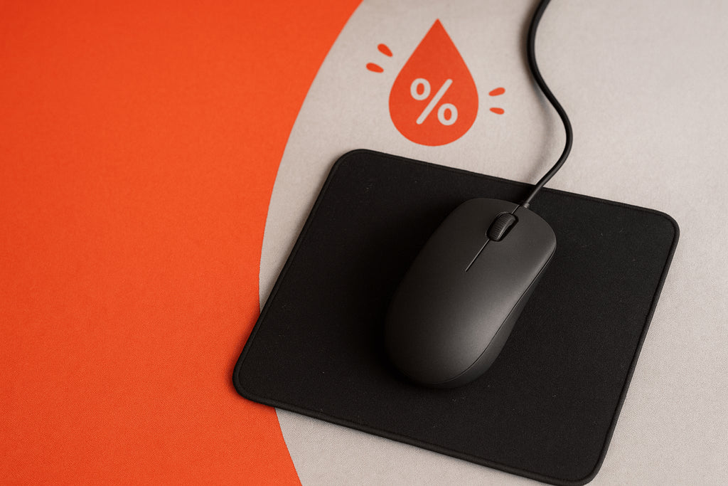 Gaming mouse pad with moisture spots