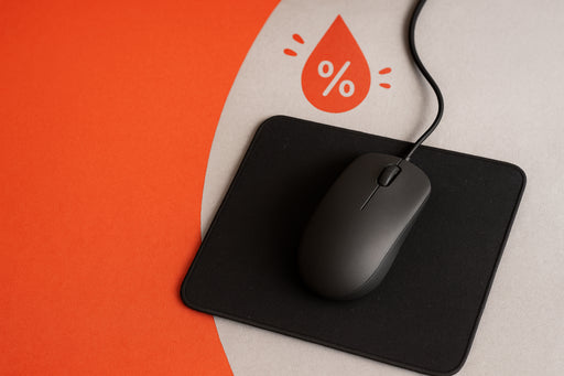 Gaming mouse pad with moisture spots