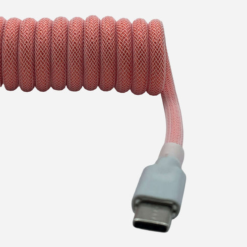 USB-C to USB-A premium light pink coiled keyboard cable close-up