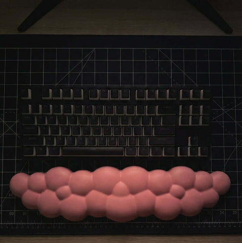 Cloud shaped pink wrist rest for keyboard desk setup