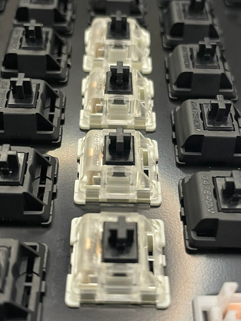 Closeup of Gateron KS-9 Black switches mounted in keyboard housing