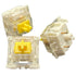 Drie Gateron KS-9 Yellow switches in verschillende posities weergegeven