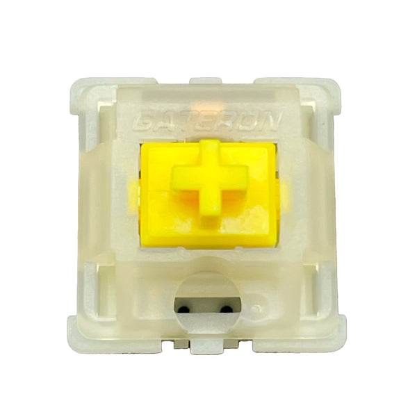 Bovenaanzicht van een Gateron Milky Yellow Pro V2 switch met gele stem en melkachtig huis