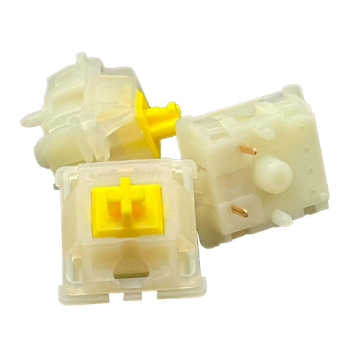 Drie losse Gateron Milky Yellow Pro V2 switches van dichtbij gefotografeerd