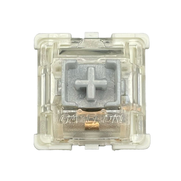 Close-up front view of the Gateron SMD Silver Pro switch showing the light grey stem and transparent housing.