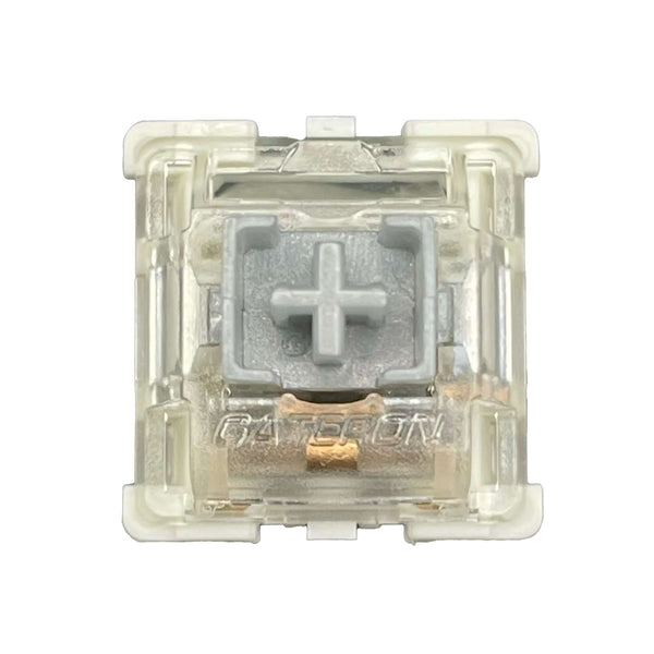 Close-up front view of the Gateron SMD Silver Pro switch showing the light grey stem and transparent housing.