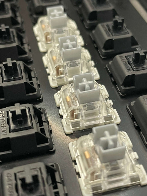 Angled overview of a keyboard featuring Gateron SMD Silver Pro switches in a highlighted section.