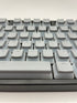 Grijze pudding keycaps op mechanisch toetsenbord met OEM-profiel – QWERTY-indeling