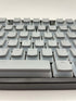 Grijze pudding keycaps op mechanisch toetsenbord met OEM-profiel – QWERTY-indeling