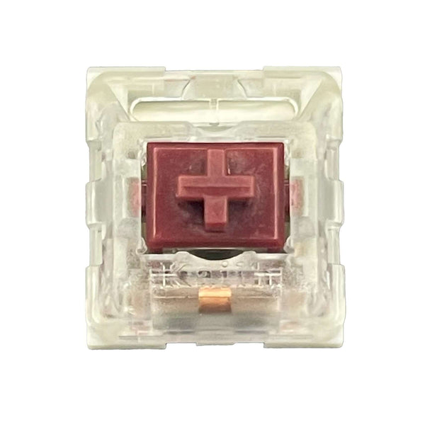 Bovenaanzicht van de Kailh Speed Coppery switch met rode stem en transparante behuizing.